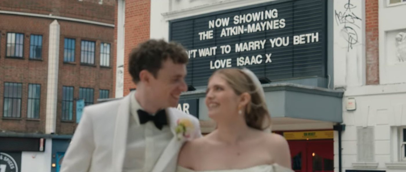 Wedding couple outside Hackney cinema marquee - Steer Media wedding film